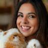Priya with two guinea pigs